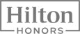 The image shows the Hilton Honors logo in grayscale with bold text inside a rectangular border.